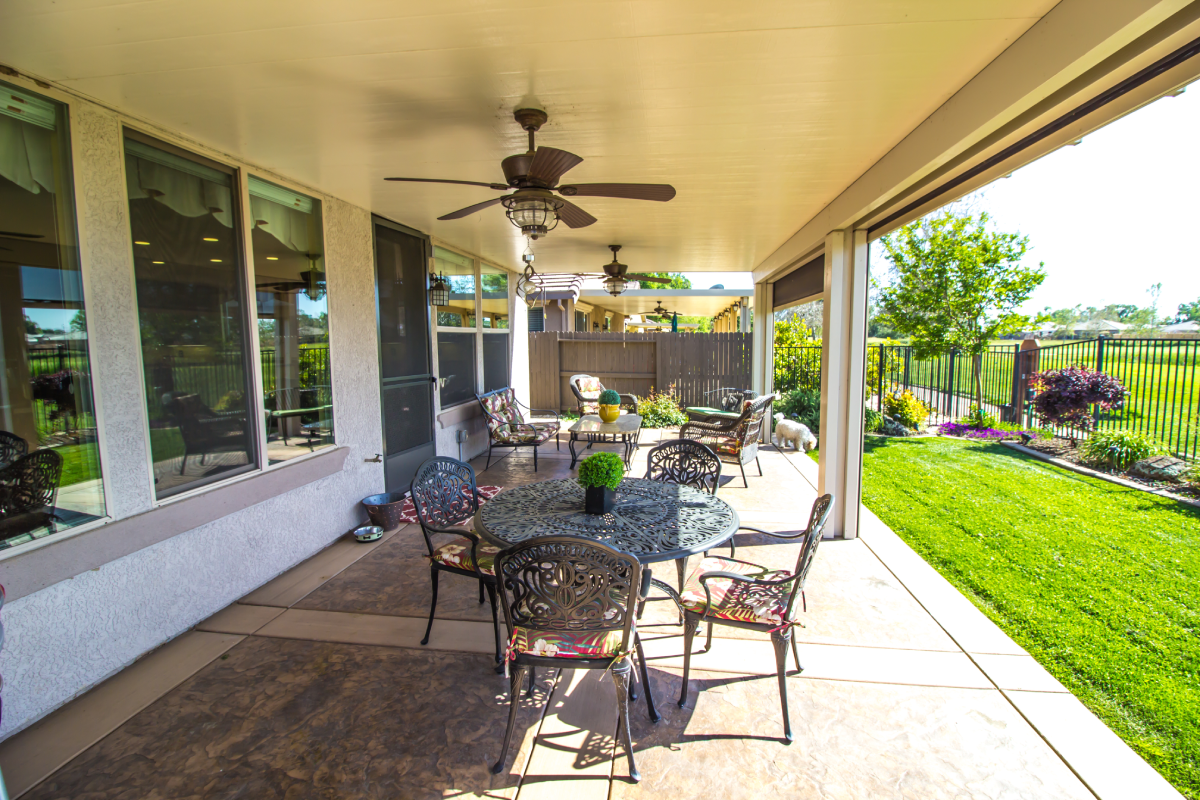 Covered patio with raised outdoor patio shades.