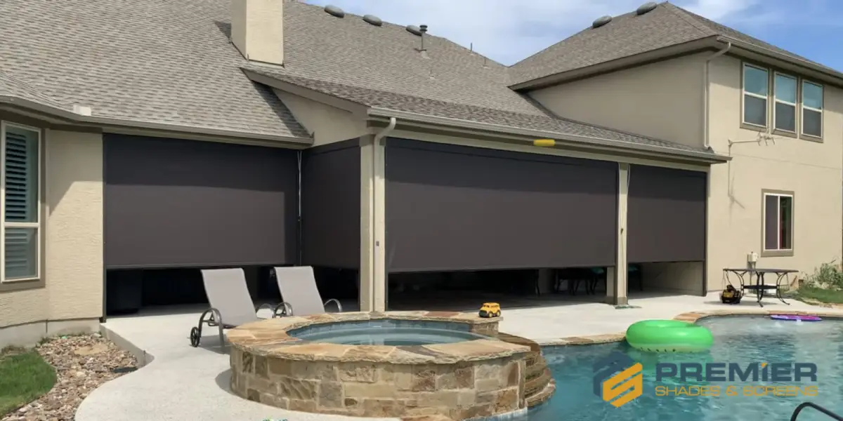Professionally installed sunshade for a patio at a home with a pool by Premier Shades & Screens